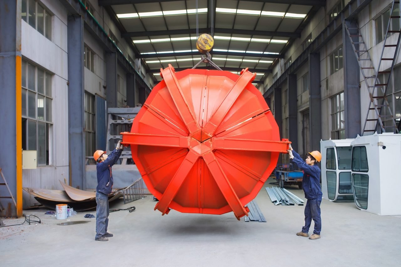 Workers Working Together In Crane Manufacturing Facility China